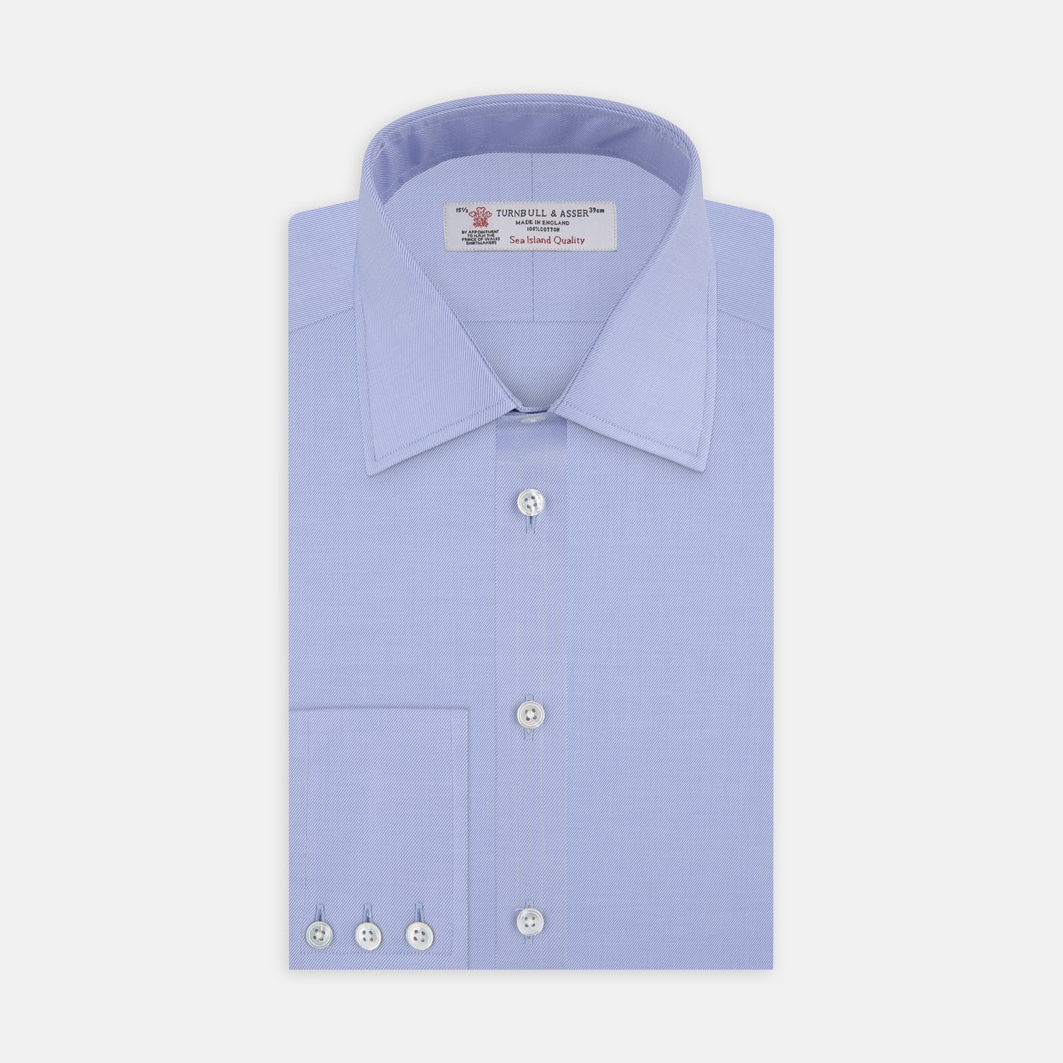 View 1 of product The Turnbull & Asser Blue Sea Island Quality Cotton Twill Shirt features a T&A collar, chest pocket, white buttons, and 3-button cuffs, all showcased on a plain white background.