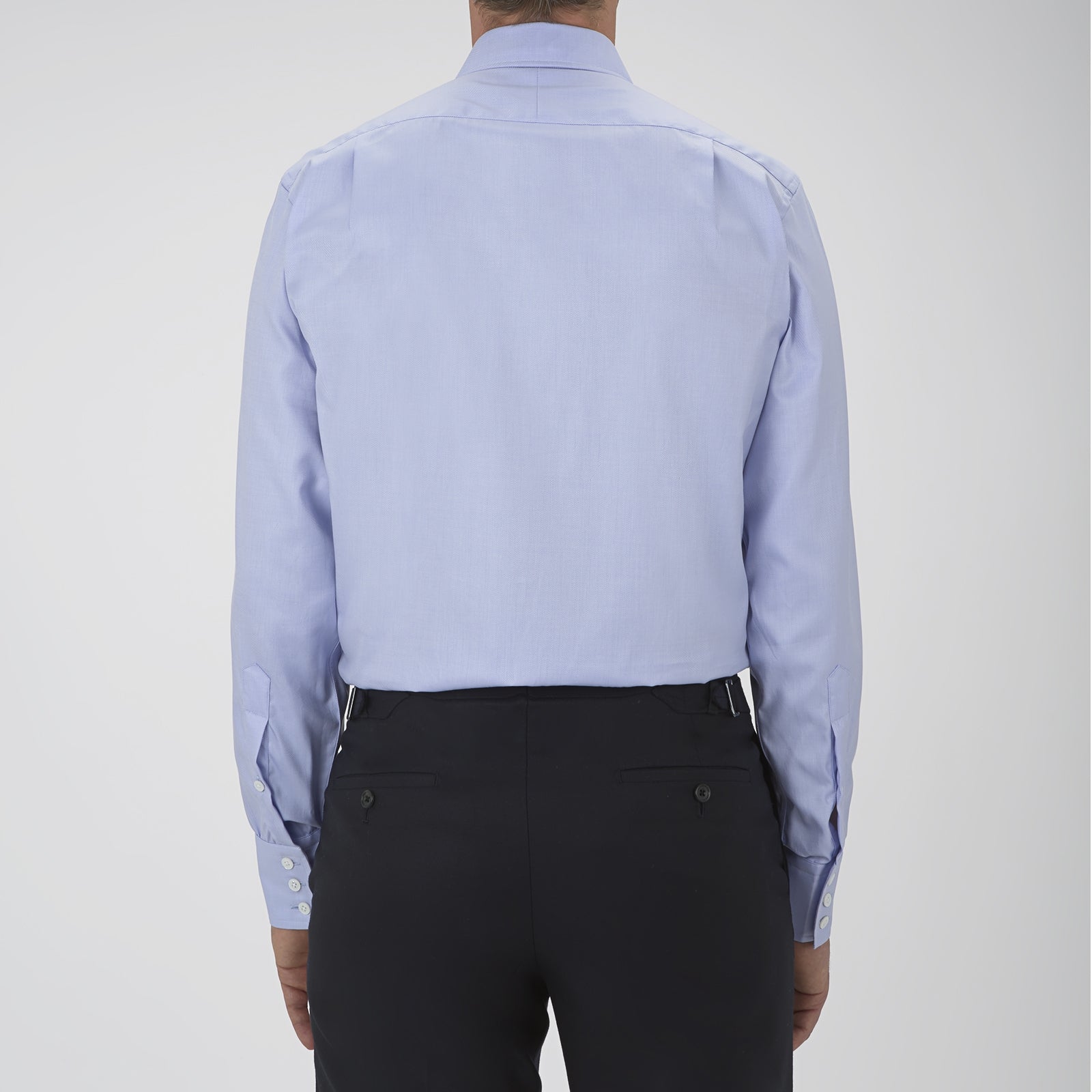 View 3 of product The Turnbull & Asser Blue Sea Island Quality Cotton Twill Shirt features a T&A collar, chest pocket, white buttons, and 3-button cuffs, all showcased on a plain white background.