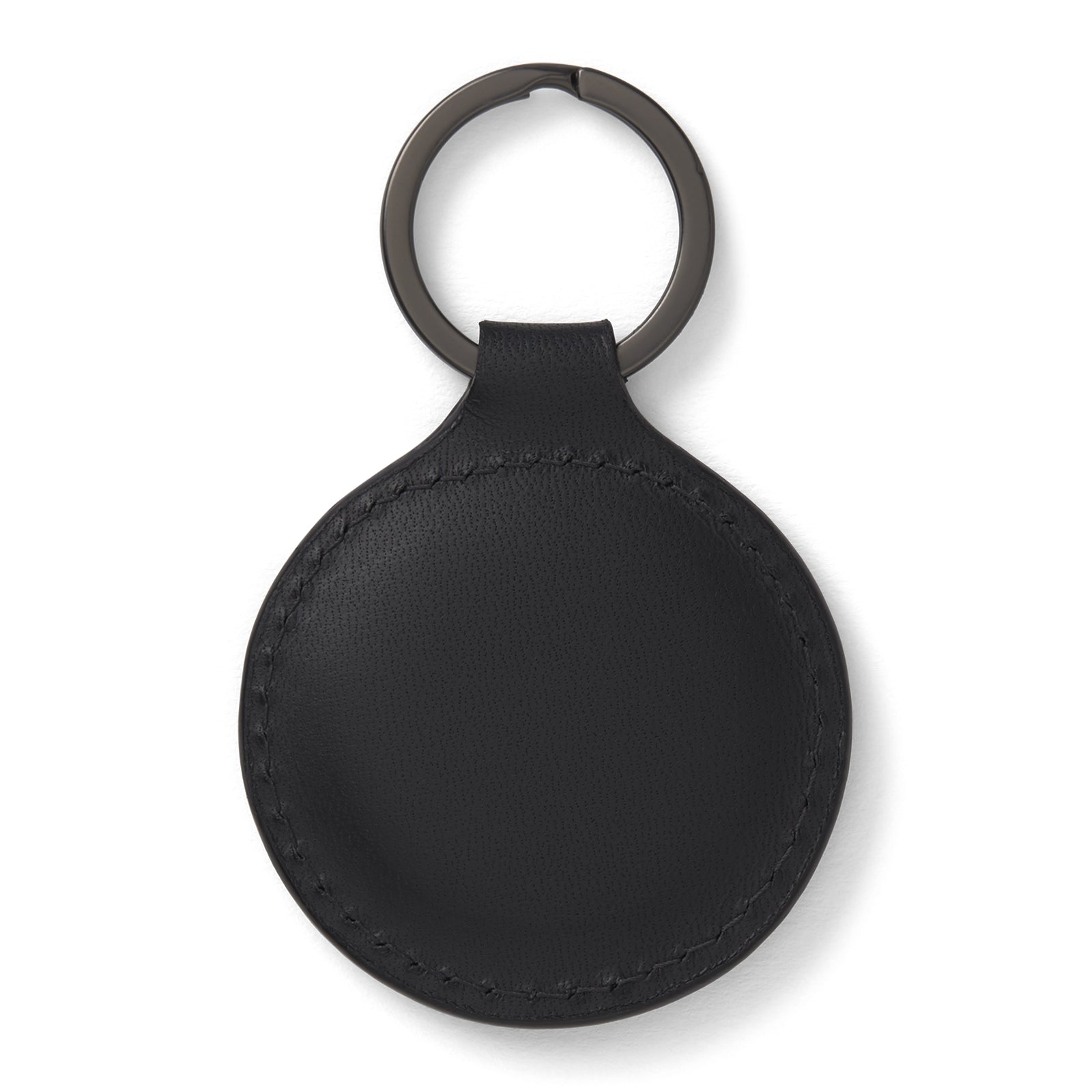 View 2 of product The Black Leather Key Fob from Turnbull & Asser features a round black leather design with a metal ring, embossed with the brand logo and "MADE IN ENGLAND"—an elegant key accessory for any collection.