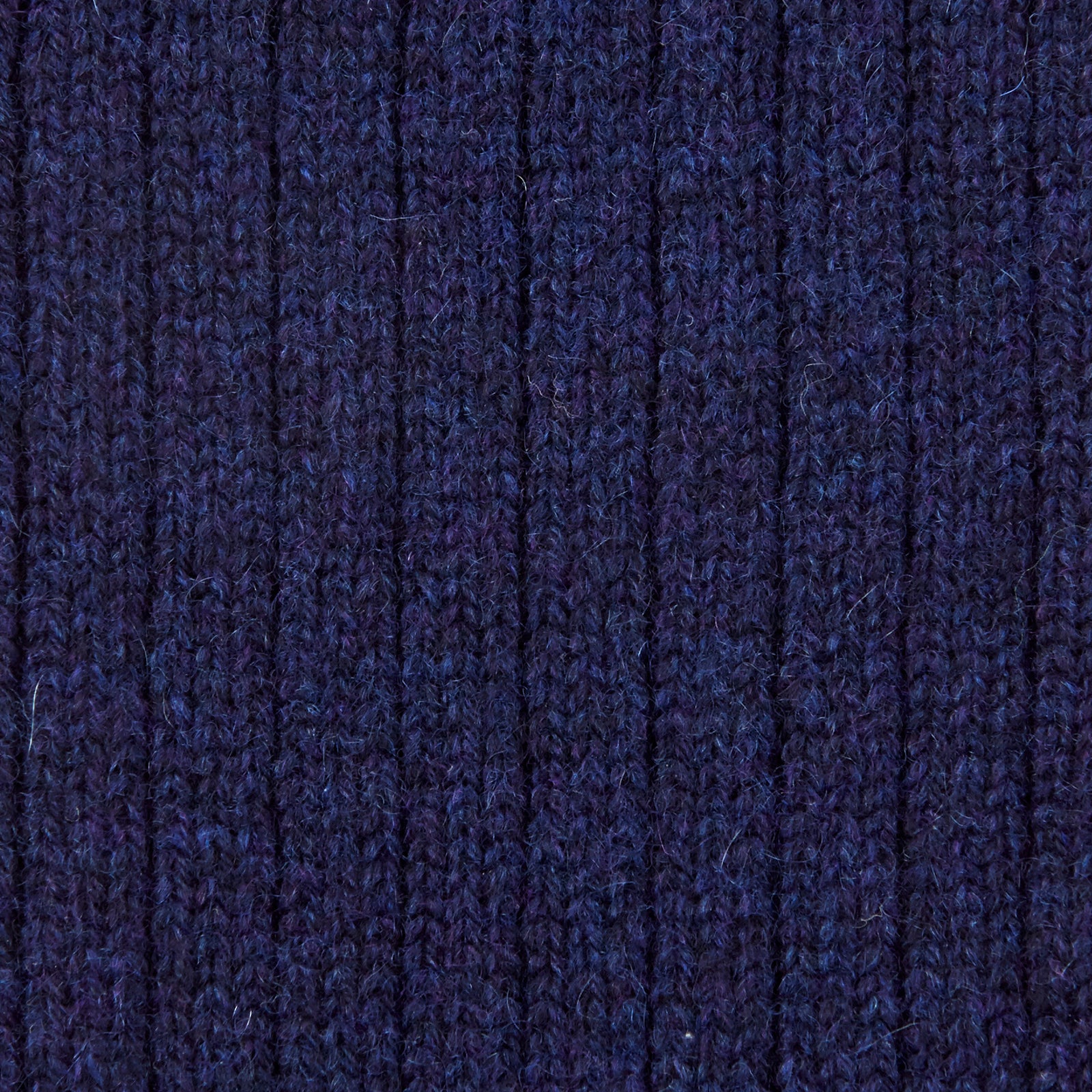 View 2 of product A single Turnbull & Asser Navy 3/4 Length Cashmere Sock is displayed on a white background, featuring a ribbed, fitted shape with subtle texture and breathable comfort for all-day wear.