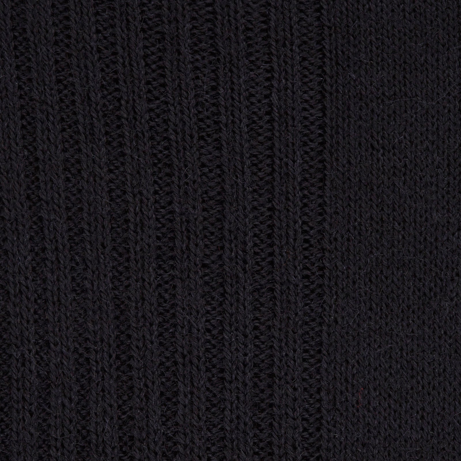 View 2 of product A single Turnbull & Asser Black Mid-Length Merino Wool Sock for men is shown upright on a plain white background, highlighting its full length and shape.