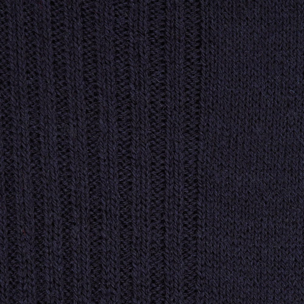 A single Deep Navy Mid-Length Merino Wool Sock from Turnbull & Asser stands upright on a white background, showcasing the comfort and timeless style characteristic of luxury men's socks.