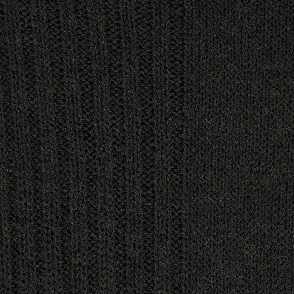 The Turnbull & Asser Racing Green Mid-Length Merino Wool Sock is shown upright on a light gray background, highlighting its refined style and luxurious quality for men.