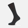 View 1 of product The Turnbull & Asser Racing Green Mid-Length Merino Wool Sock is shown upright on a light gray background, highlighting its refined style and luxurious quality for men.