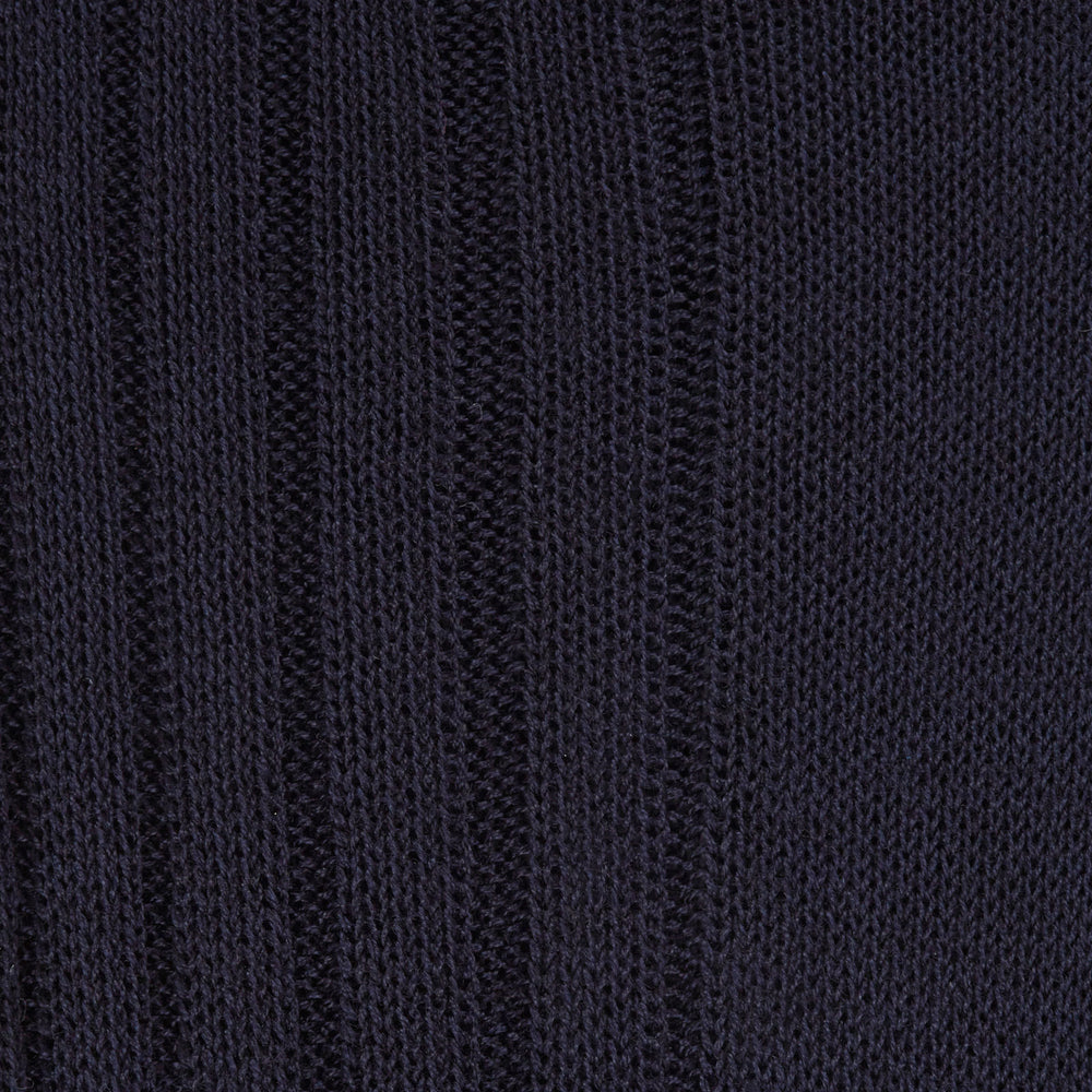 A single Turnbull & Asser Navy Short Cotton Sock stands upright against a light gray background, highlighting the refined elegance and luxury of premium men’s socks.