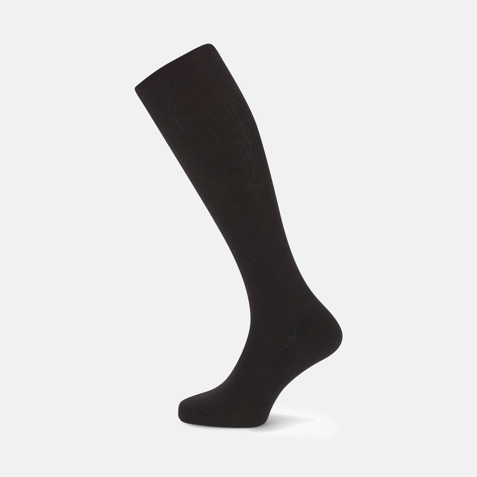 View 1 of product A single Turnbull & Asser Black Long Merino Wool Sock stands upright on a white background, highlighting its ribbed texture that runs from toe to just below the knee.