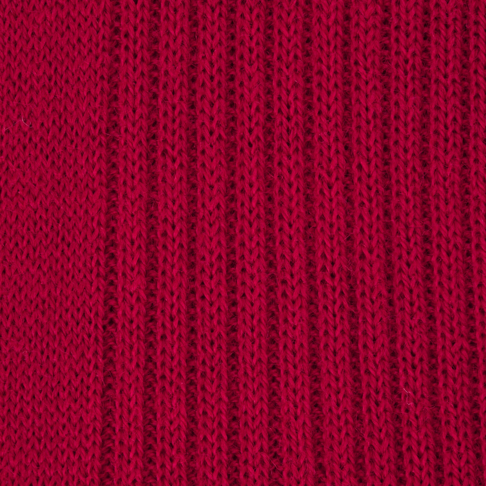 View 2 of product A single Red Long Merino Wool Sock by Turnbull & Asser stands upright against a light gray background, highlighting the elegance and luxury of premium men’s socks.