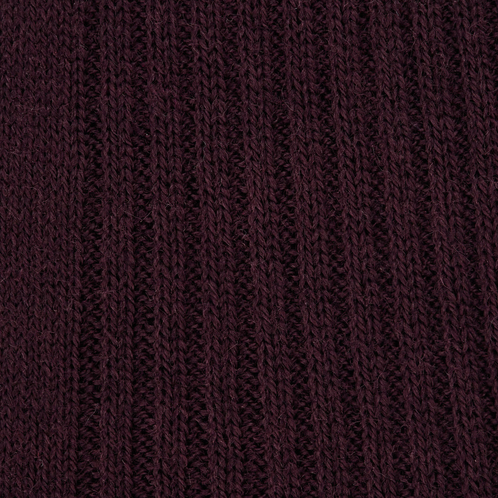 A single Turnbull & Asser Maroon Long Merino Wool Sock, knee-high and ribbed, is displayed upright against a plain white background.