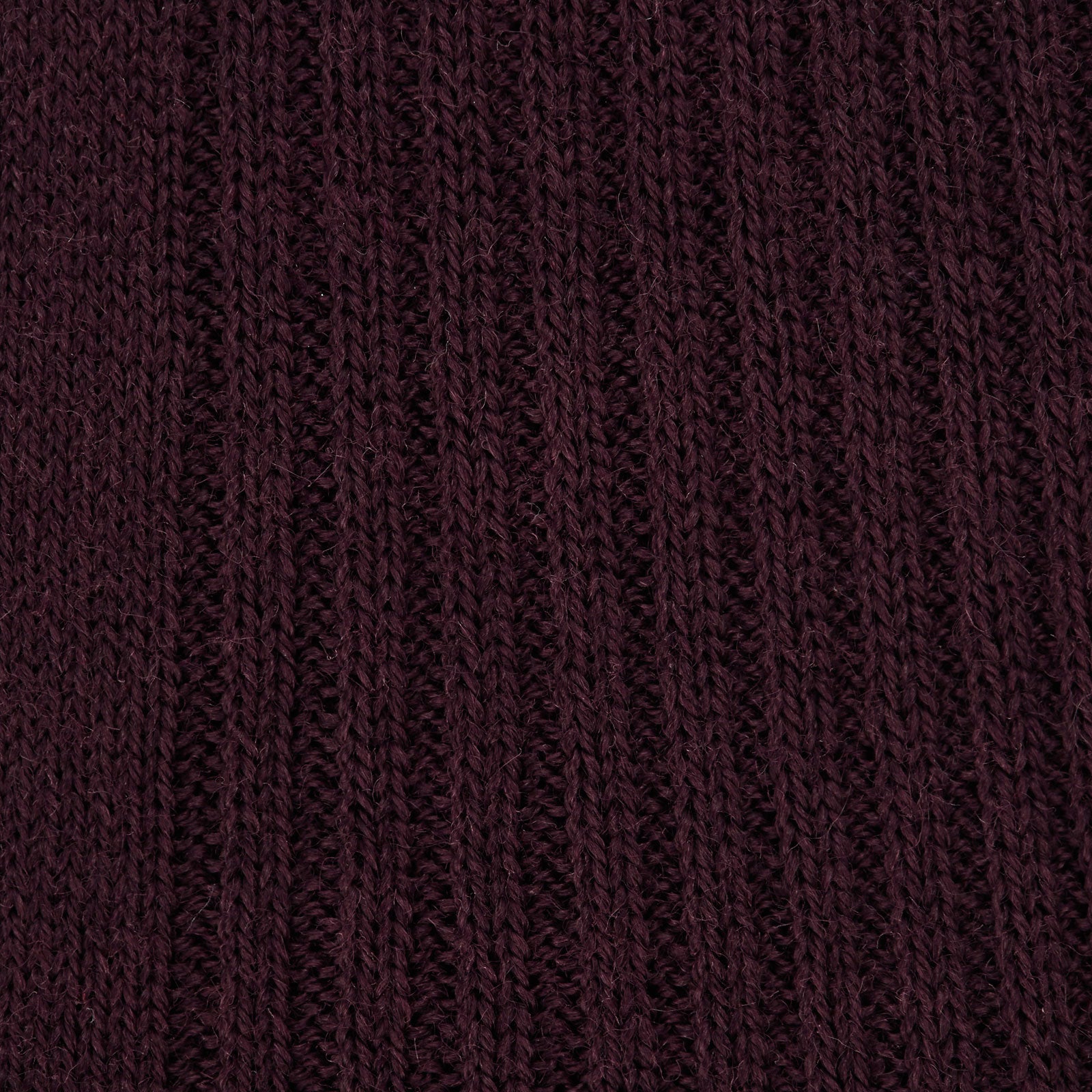 View 2 of product A single Turnbull & Asser Maroon Long Merino Wool Sock, knee-high and ribbed, is displayed upright against a plain white background.