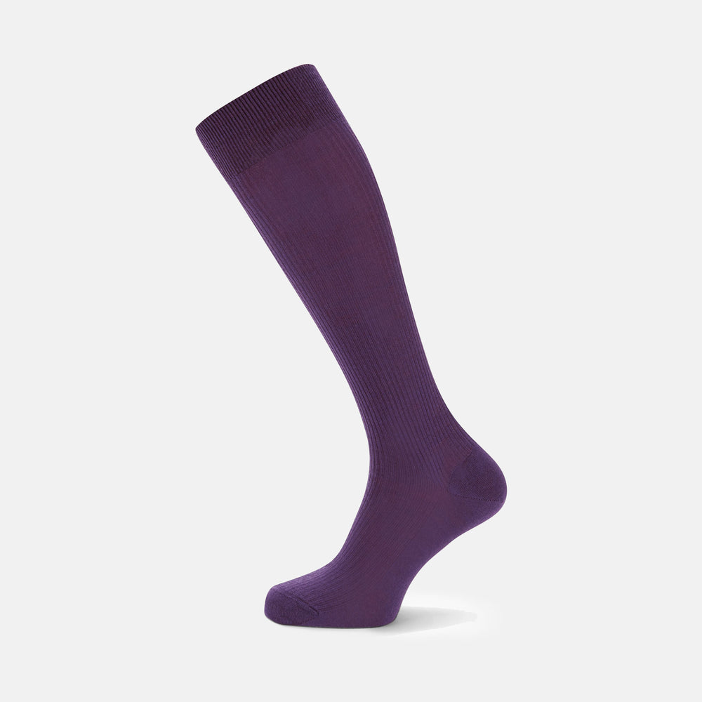 A single Purple Long Merino Wool Sock by Turnbull & Asser is showcased on a foot-shaped mannequin against a white background, highlighting the luxurious craftsmanship of premium men’s socks.