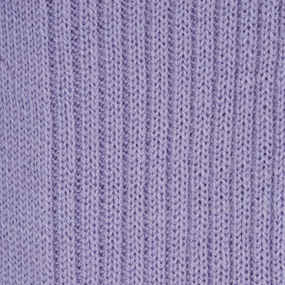 A single Lilac Long Merino Wool Sock by Turnbull & Asser is shown in side profile on a plain light gray background, featuring a ribbed texture and knee-high length.