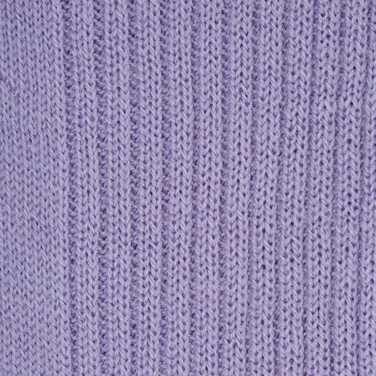 View 2 of product A single Lilac Long Merino Wool Sock by Turnbull & Asser is shown in side profile on a plain light gray background, featuring a ribbed texture and knee-high length.