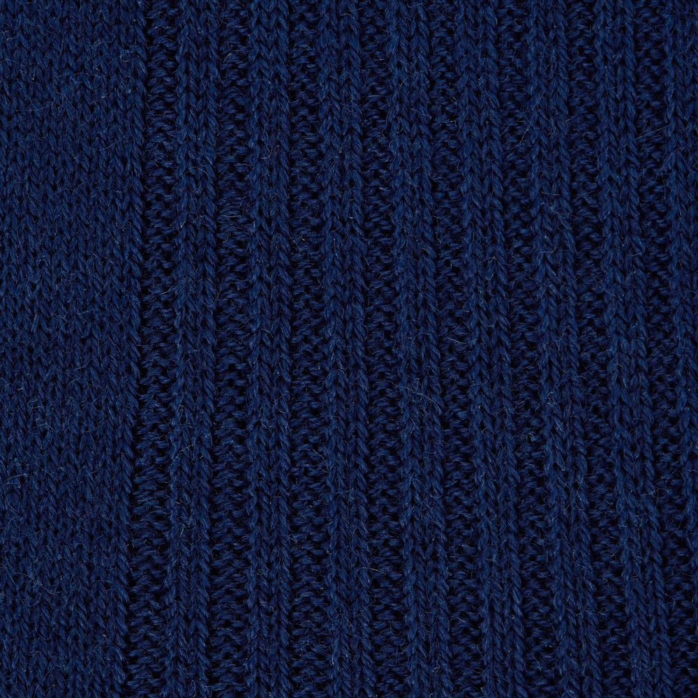 A single Turnbull & Asser Midnight Blue Long Merino Wool Sock with a ribbed texture is shown against a plain light gray background.