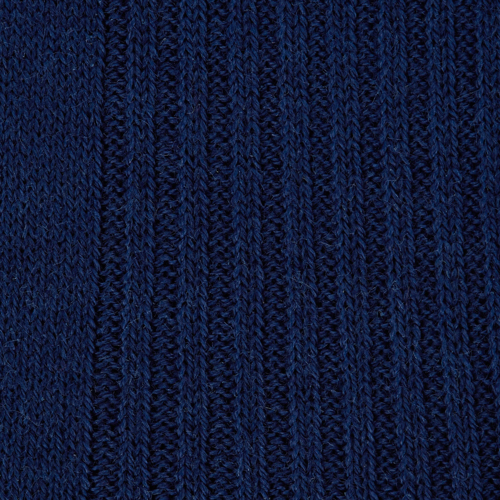 View 2 of product A single Turnbull & Asser Midnight Blue Long Merino Wool Sock with a ribbed texture is shown against a plain light gray background.