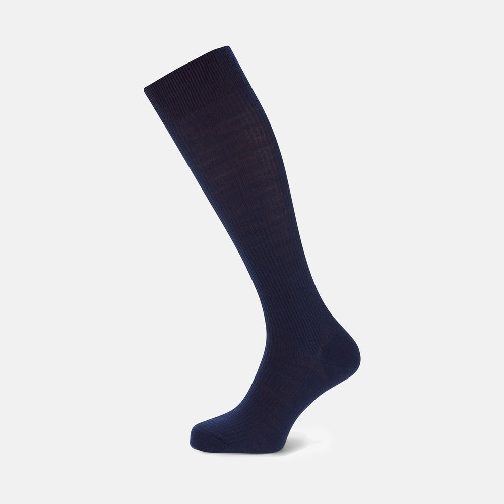 A single Turnbull & Asser Midnight Blue Long Merino Wool Sock with a ribbed texture is shown against a plain light gray background.