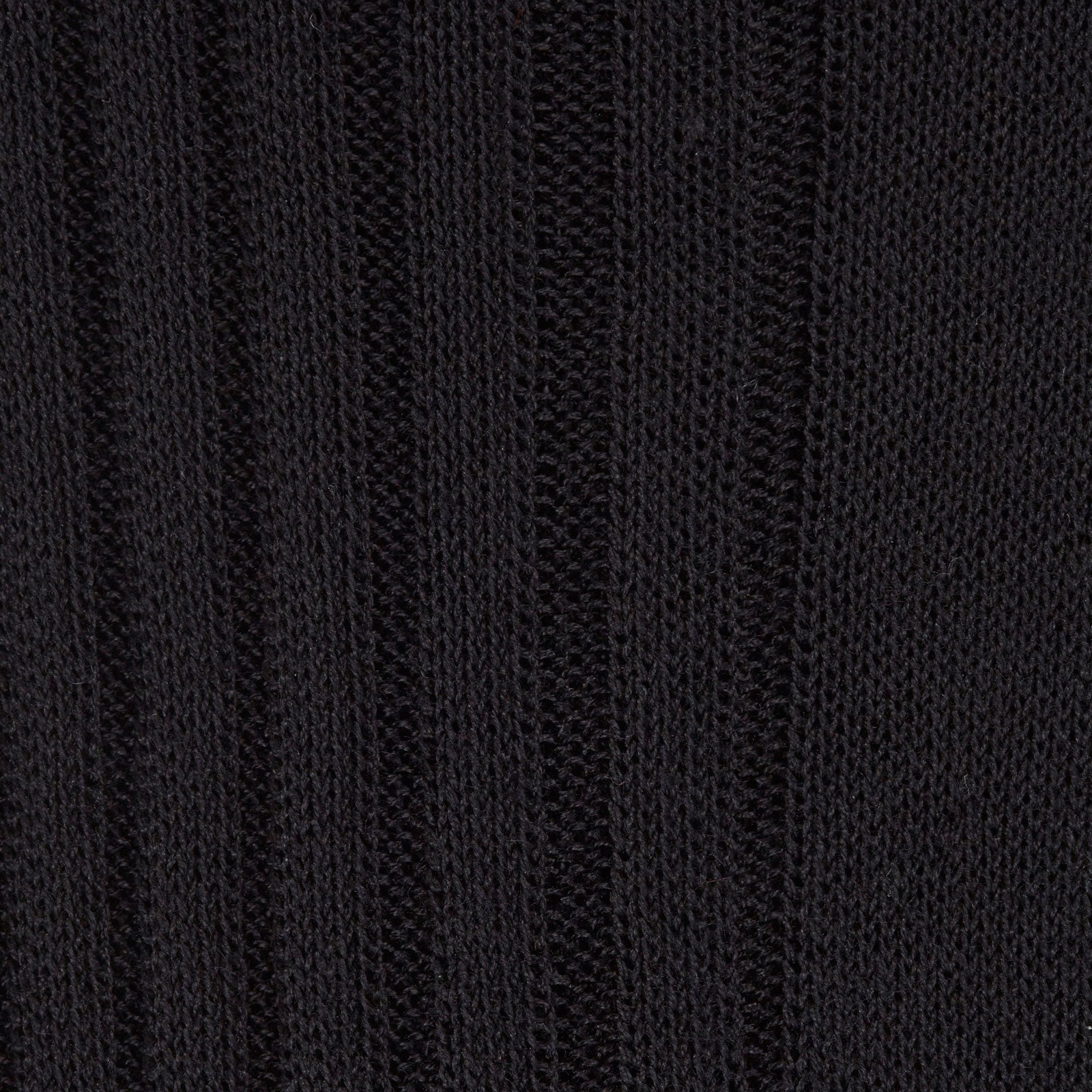 View 2 of product A single Black Long Cotton Sock by Turnbull & Asser, shown knee-high in black with a subtle ribbed texture, is displayed in a side profile against a plain white background.