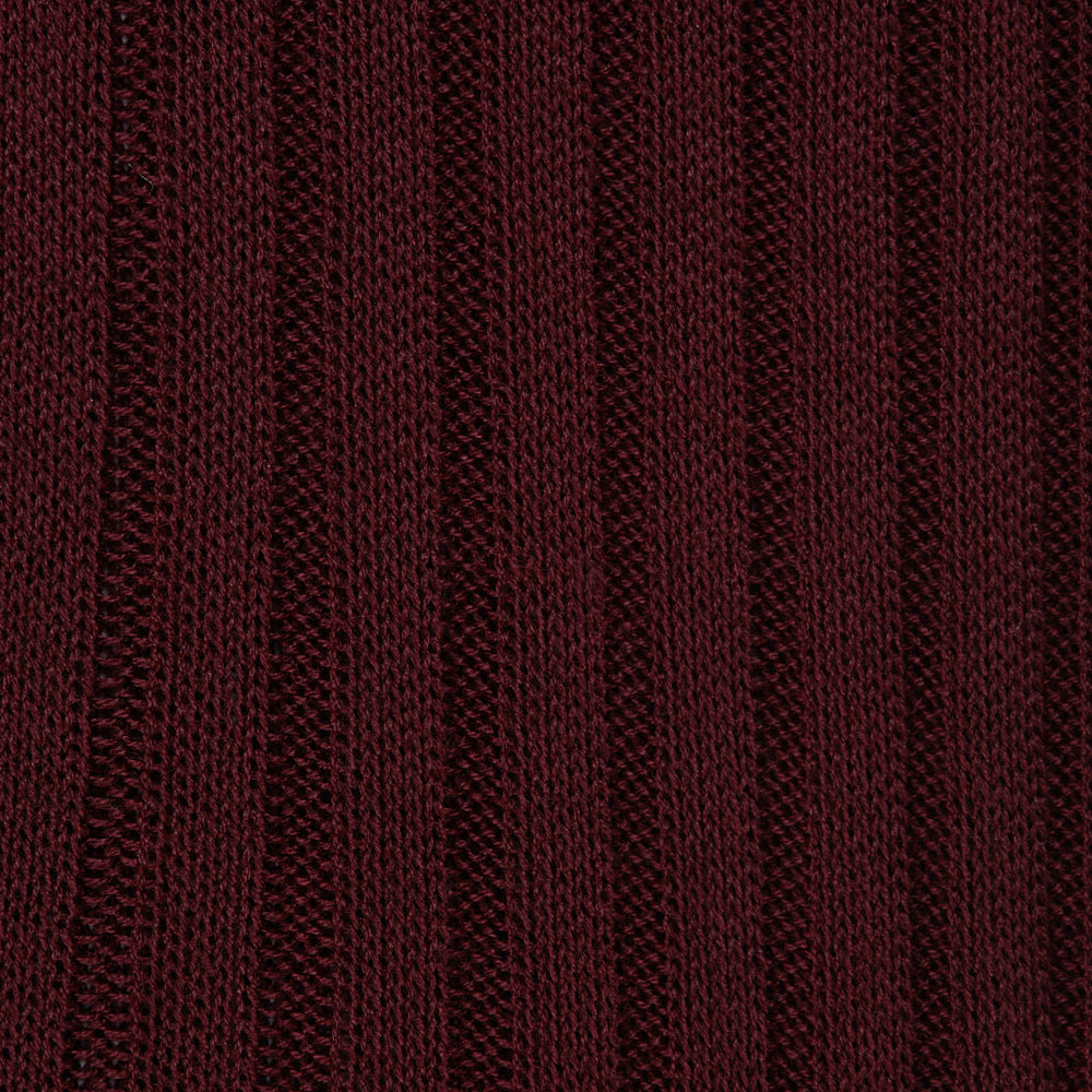 The Turnbull & Asser Oxblood Long Cotton Sock, crafted from premium Fil d’Ecosse with a ribbed texture, is displayed in side profile on a white background, showcasing its luxury men’s design and rich dark brown color.