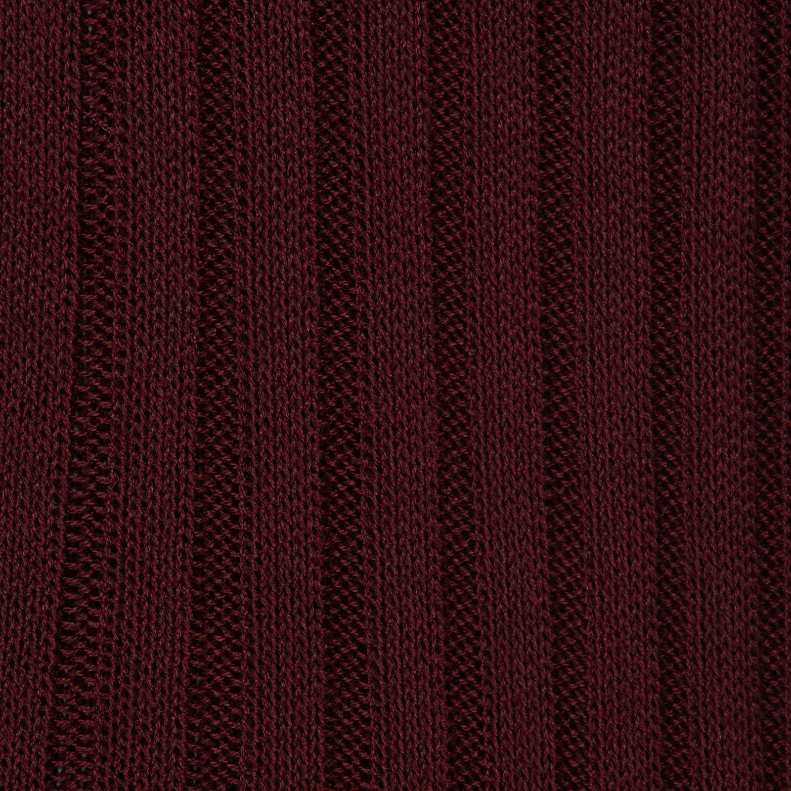 View 2 of product The Turnbull & Asser Oxblood Long Cotton Sock, crafted from premium Fil d’Ecosse with a ribbed texture, is displayed in side profile on a white background, showcasing its luxury men’s design and rich dark brown color.