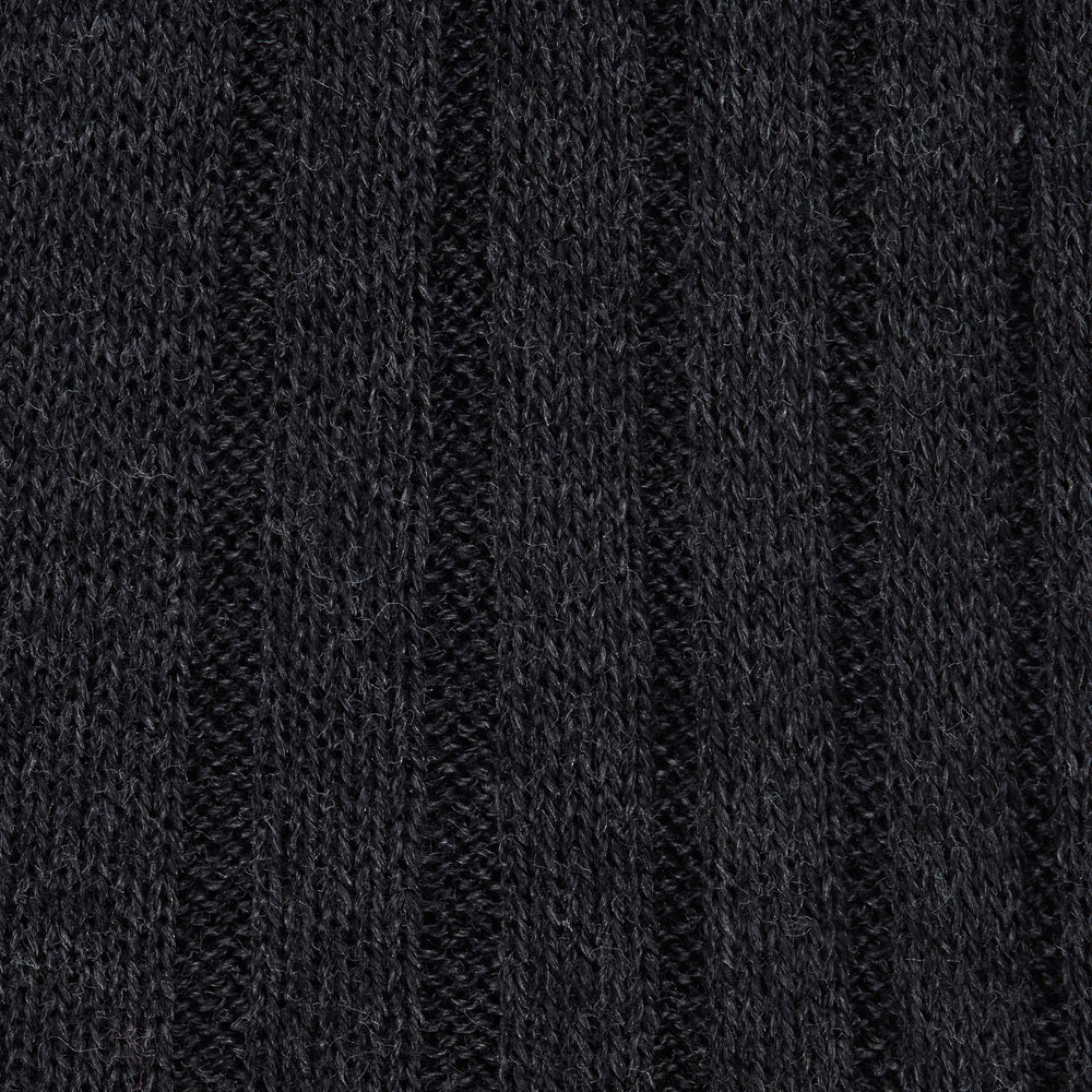 A single Turnbull & Asser Dark Grey Long Cotton Sock is shown in side view against a white background, with the toe pointing right and the cuff at the top.