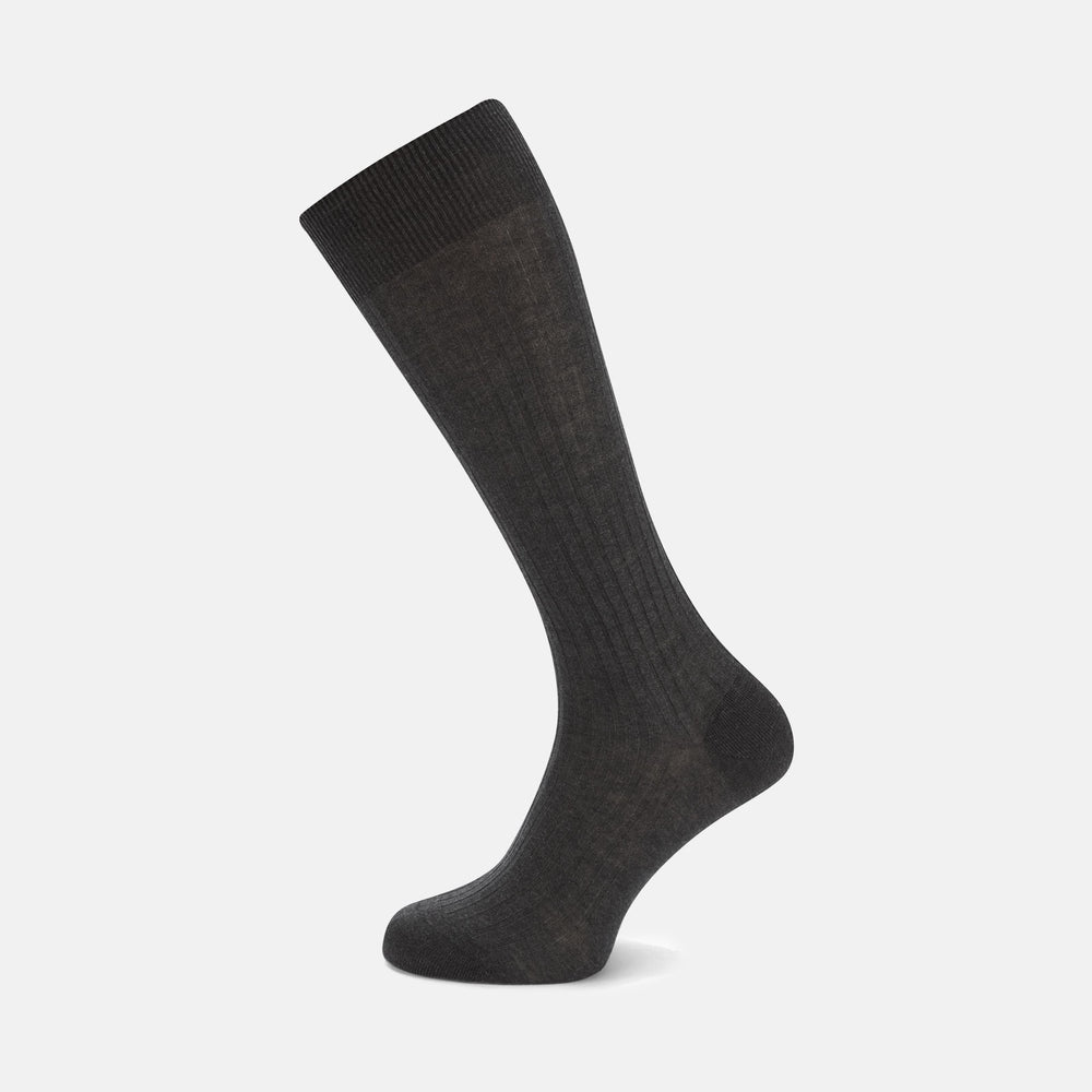 A single Turnbull & Asser Dark Grey Long Cotton Sock is shown in side view against a white background, with the toe pointing right and the cuff at the top.