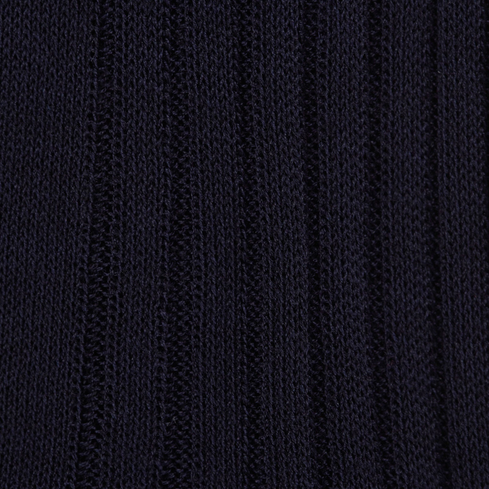 View 2 of product A single navy long cotton sock by Turnbull & Asser stands upright on a white background, showcasing its ribbed texture and fitted shape.