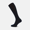 View 1 of product A single navy long cotton sock by Turnbull & Asser stands upright on a white background, showcasing its ribbed texture and fitted shape.