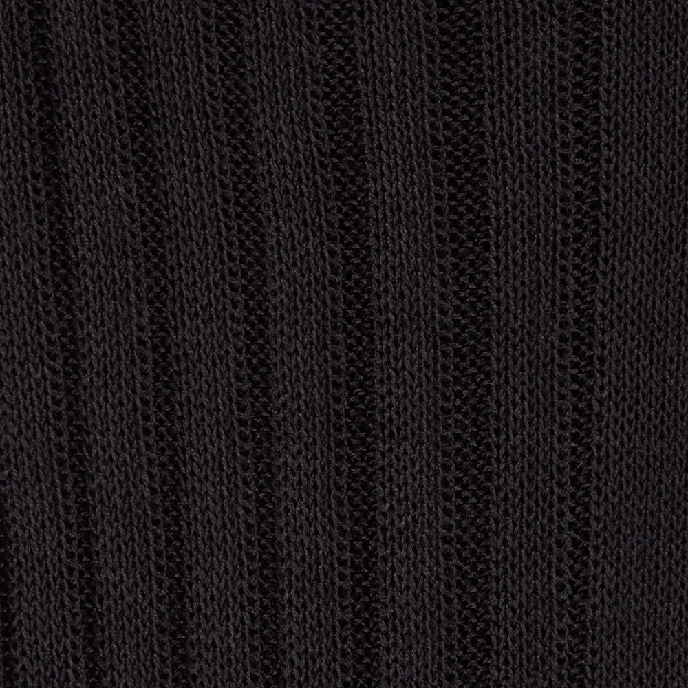 A single Charcoal Long Cotton Sock by Turnbull & Asser, in black Egyptian cotton, is shown against a plain white background at an angle with the foot pointing downward and the leg extending upward.