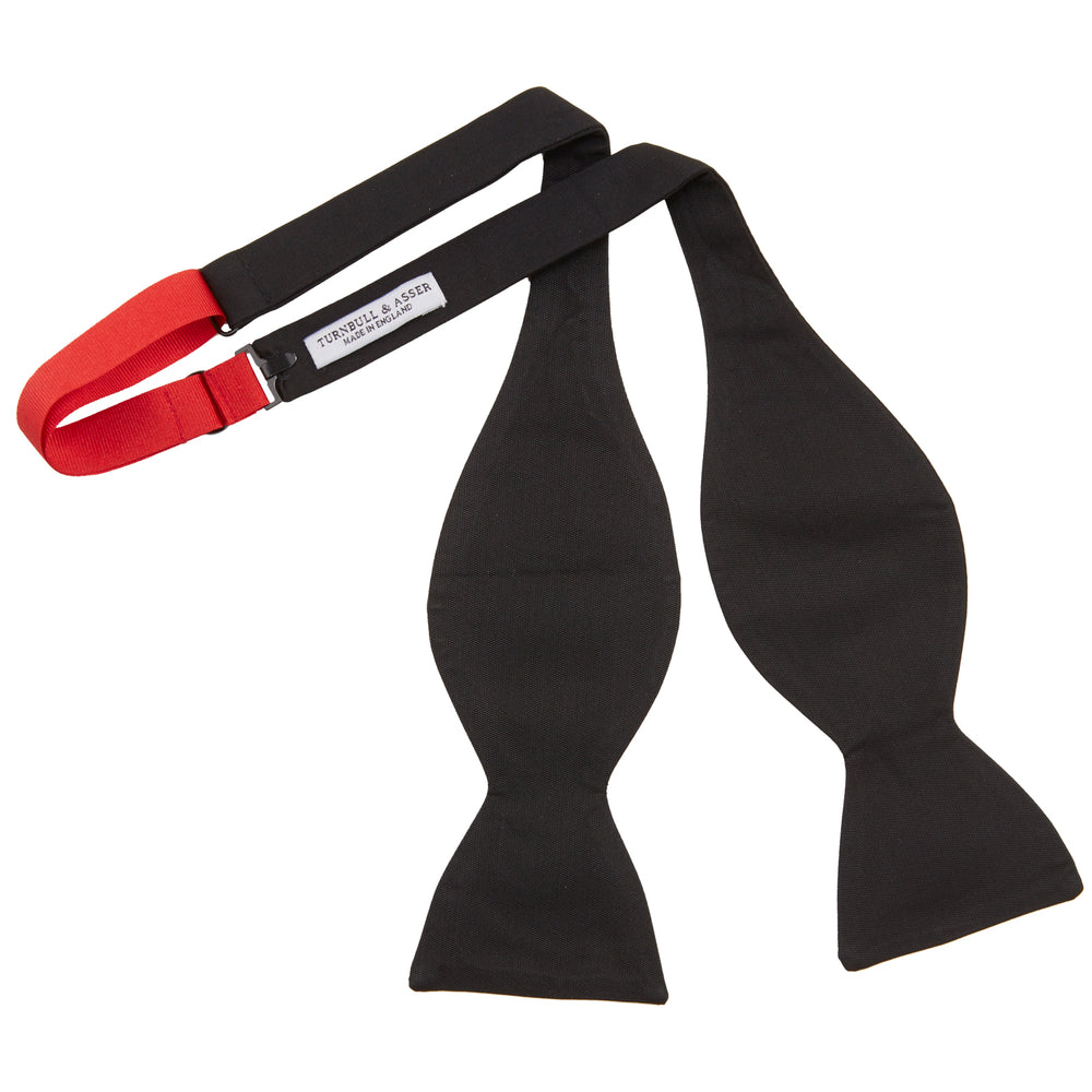 The Turnbull & Asser Black Barathea Bow Tie, made from luxurious silk with a classic, symmetrical shape, is displayed against a plain white background—ideal for formal occasions.