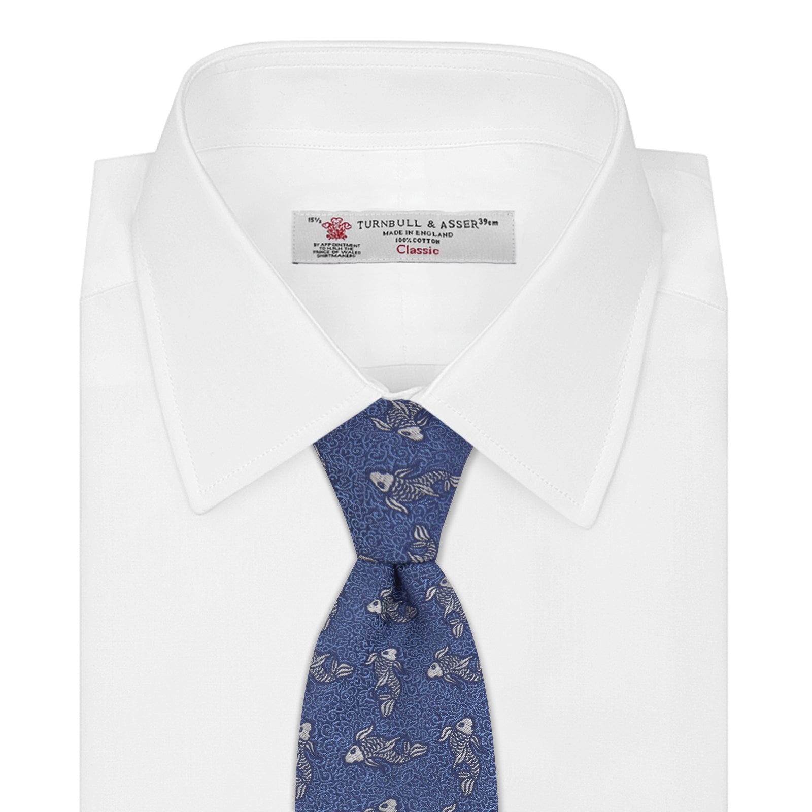 View 2 of product The Blue Carp Silk Tie by Turnbull & Asser features a blue silk base with white and dark blue koi fish among light blue swirls. The tie is displayed rolled up, pointed end forward.