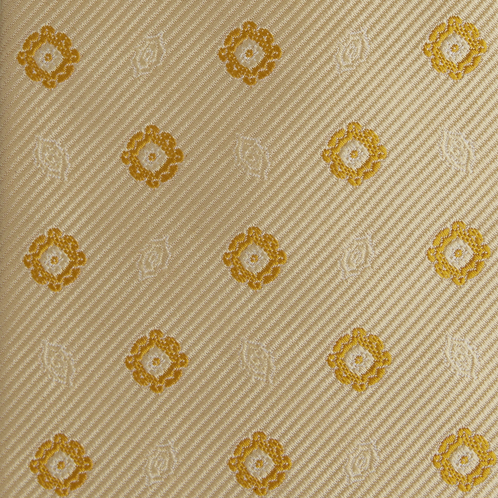The Turnbull & Asser Soft Yellow Floral Jacquard Stripe Silk Tie features a rolled-up beige design with subtle texture and small yellow floral patterns evenly spaced throughout.