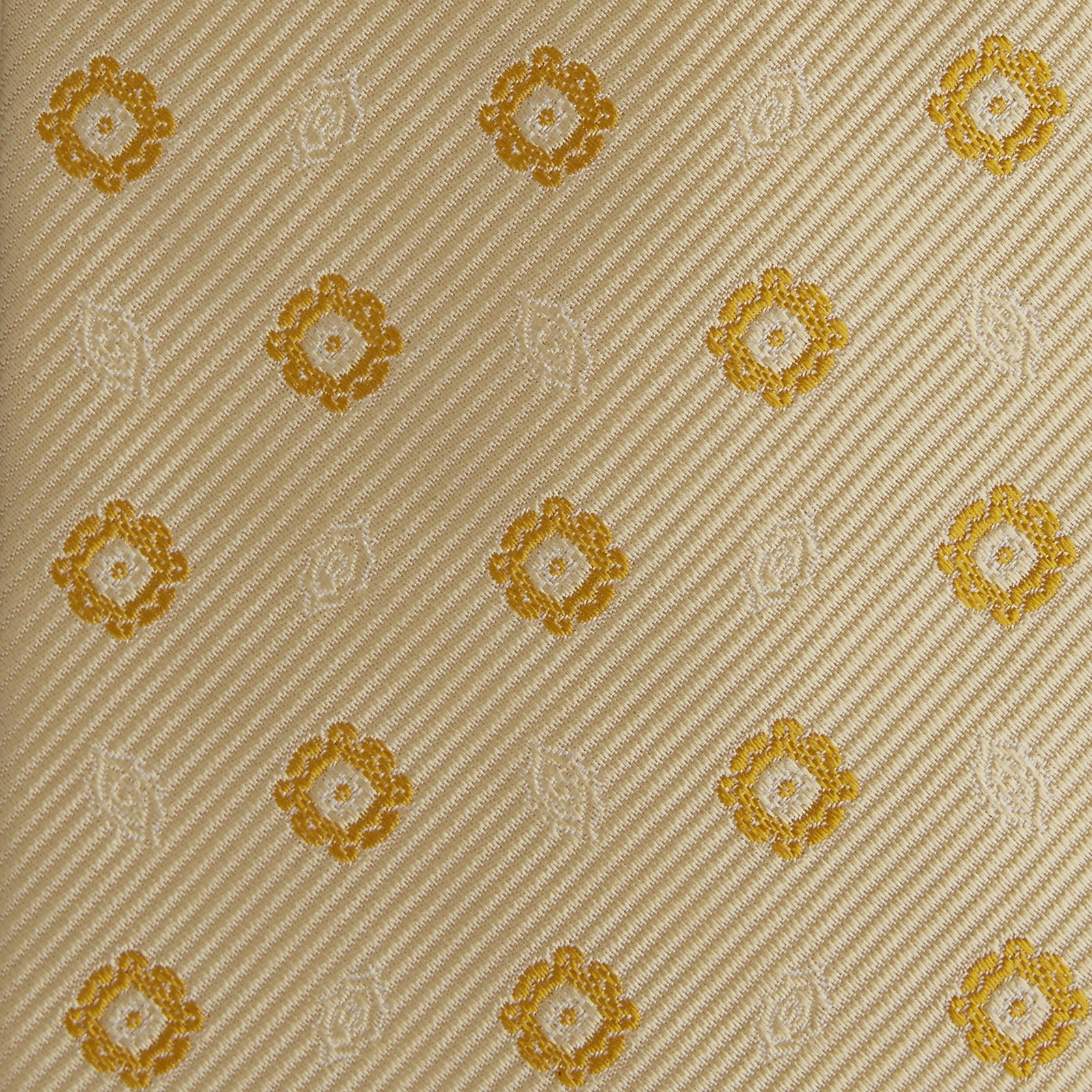 View 3 of product The Turnbull & Asser Soft Yellow Floral Jacquard Stripe Silk Tie features a rolled-up beige design with subtle texture and small yellow floral patterns evenly spaced throughout.