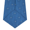 View 4 of product The Turnbull & Asser Blue Flower Mosaic Silk Tie features a blue silk fabric with a detailed geometric and floral design, accented in lighter blue and white, displayed on a white background.