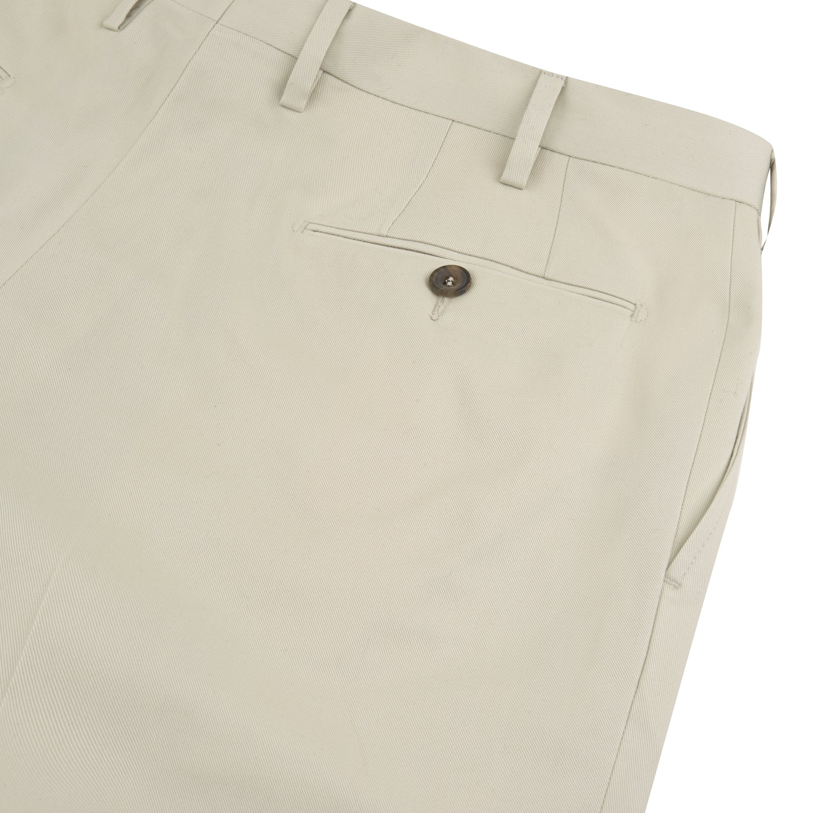 View 2 of product Turnbull & Asser's Stone Cotton Twill Pleated Trousers feature a relaxed fit, front pleats, side pockets, belt loops, and button closure, shown laid flat on a white background.