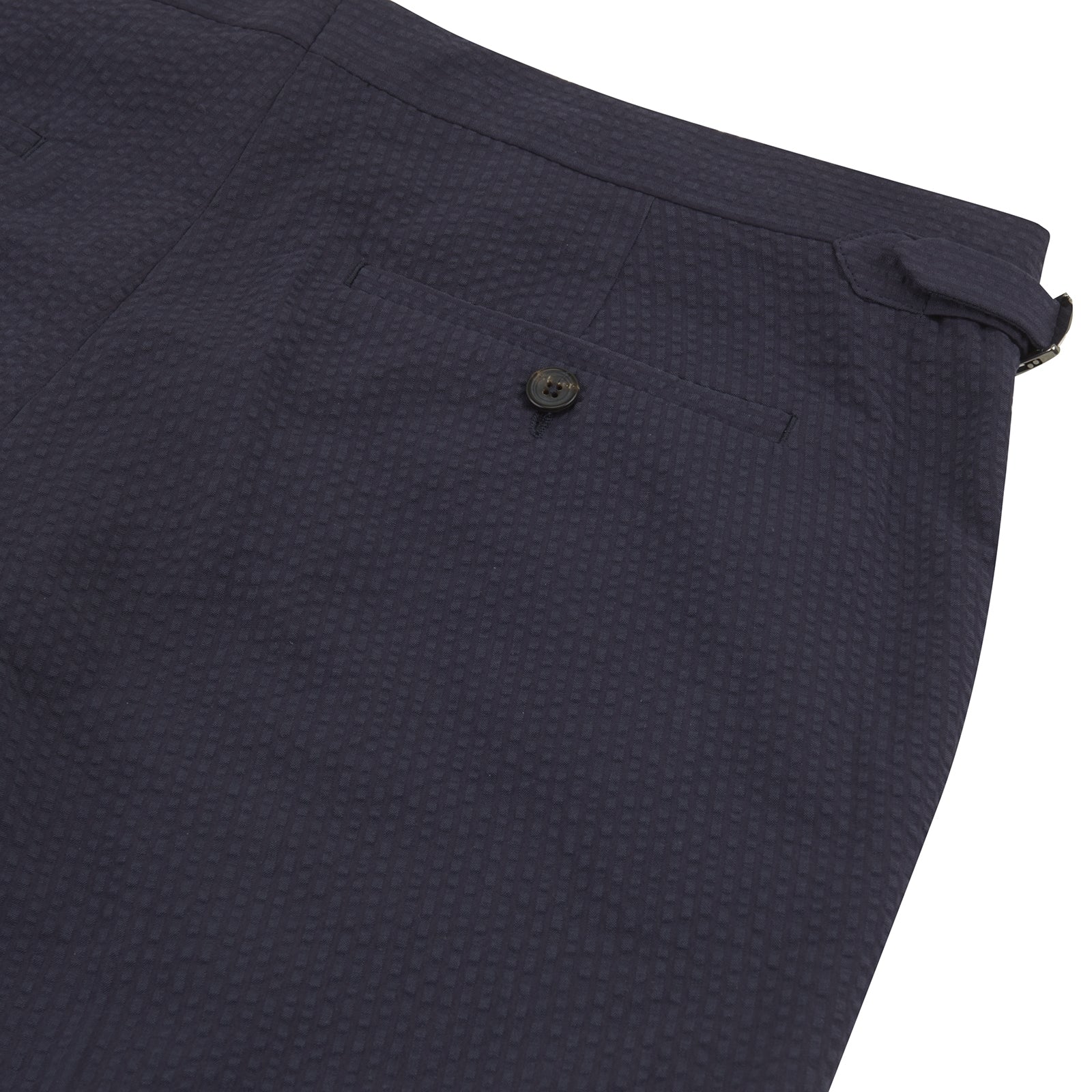 View 2 of product Turnbull & Asser Navy Cotton Seersucker Trousers, featuring a straight-leg fit, belt loops, and concealed front closure, crafted from lightweight Italian seersucker fabric, displayed on a plain white background.