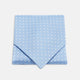 The Turnbull & Asser Sky Blue and White Medium Spot Silk Ascot Tie, neatly folded against a white background, is stylish neckwear—perfect for any wedding guest.