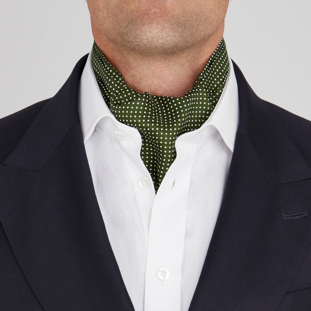 View 2 of product The Turnbull & Asser Olive Green and White Small Spot Silk Ascot Tie is a stylish accessory for wedding guests, featuring a classic pattern that pairs perfectly with a matching pocket square.