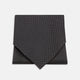 The Turnbull & Asser Black and White Mini Spot Silk Cravat, featuring a refined polka dot pattern, is displayed elegantly on a plain light background—an ideal wedding guest accessory.