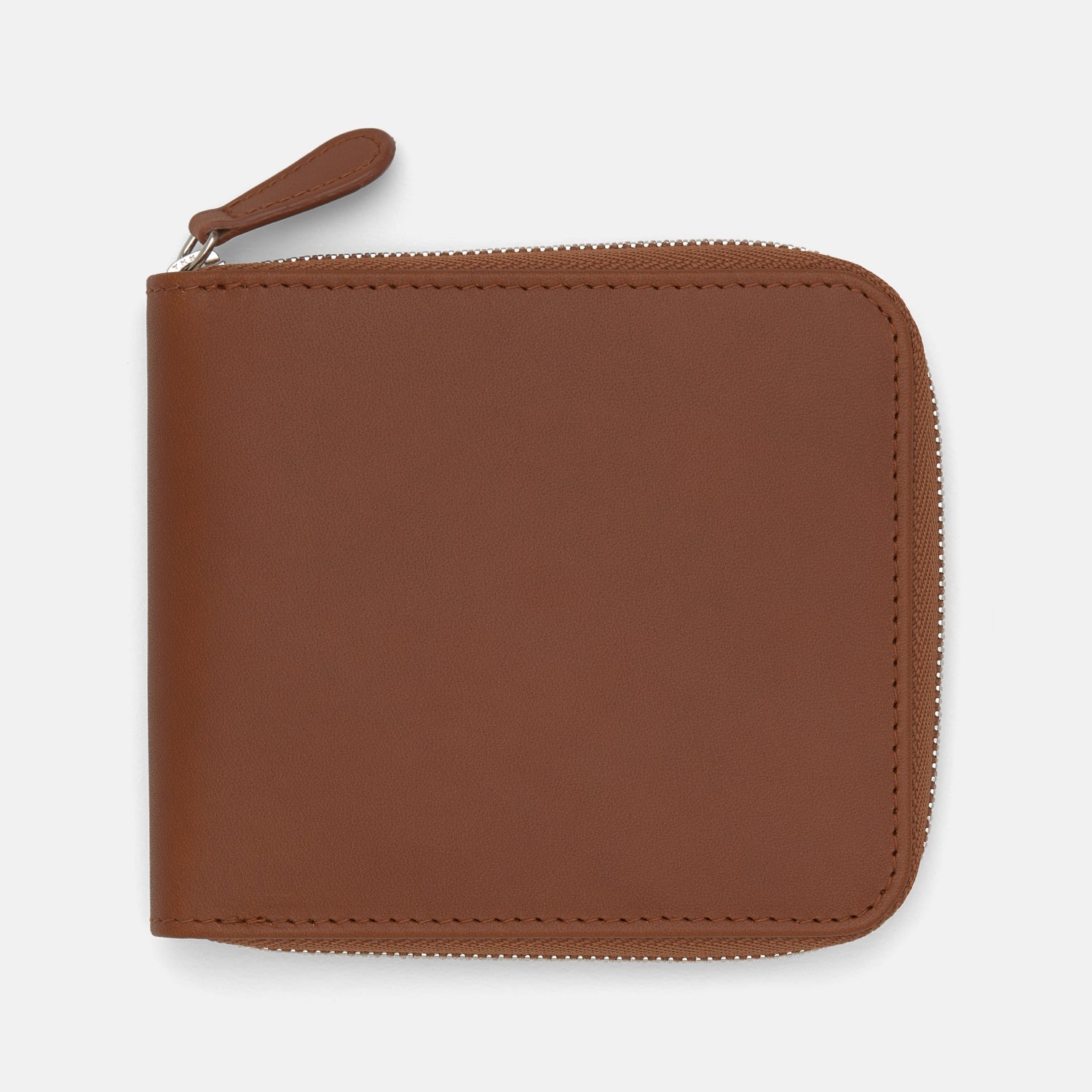 View 1 of product The Light Tan Leather 8 C/C Zipped Wallet by Turnbull & Asser, with a smooth square design, features a leather pull tab and zipper along two sides. It is shown closed against a plain white background.