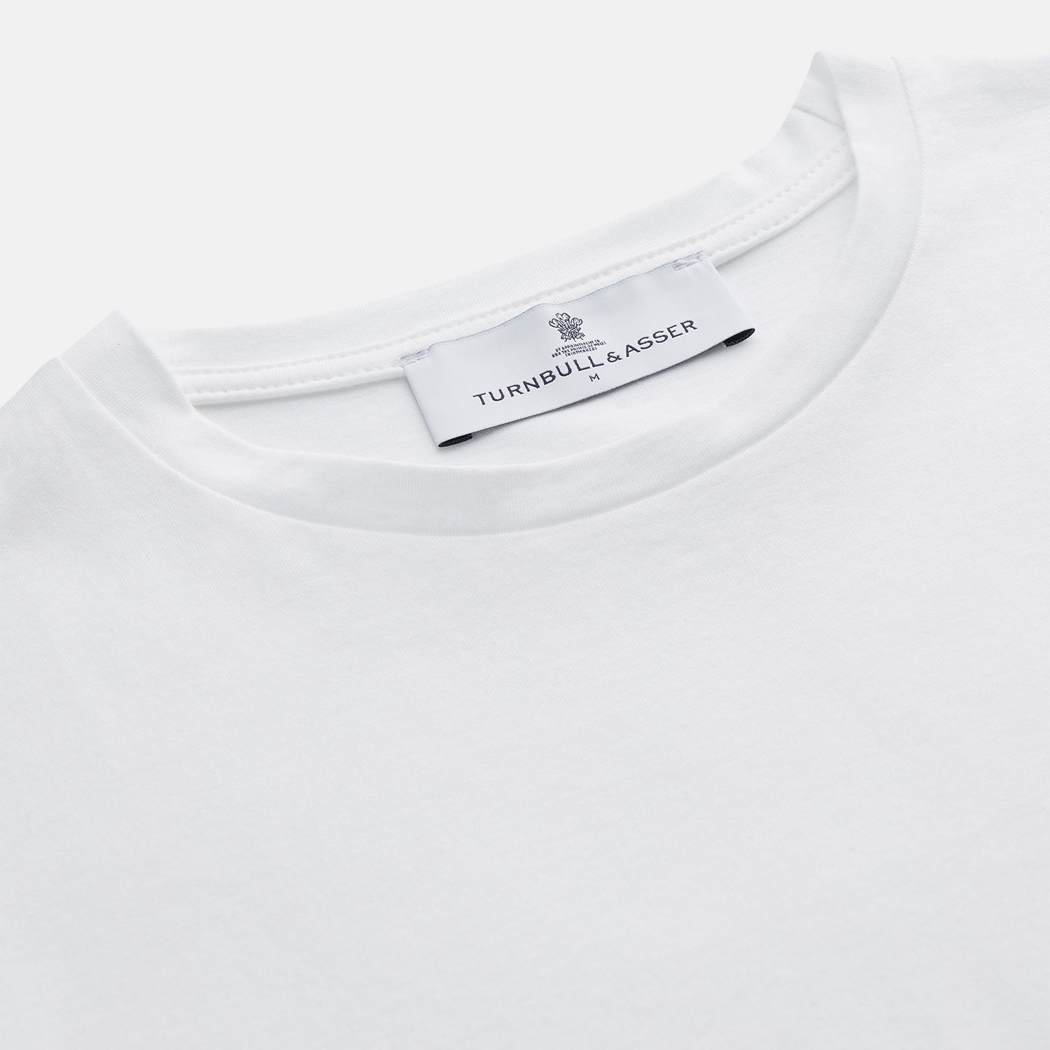 View 4 of product The Turnbull & Asser White Davey Cotton T-Shirt is shown on a white background. Crafted from fine-gauge jersey, it features short sleeves, a classic crew neck, and a clean front with no visible logos or designs.